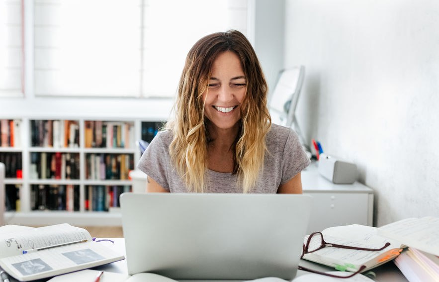 Happy woman at computer