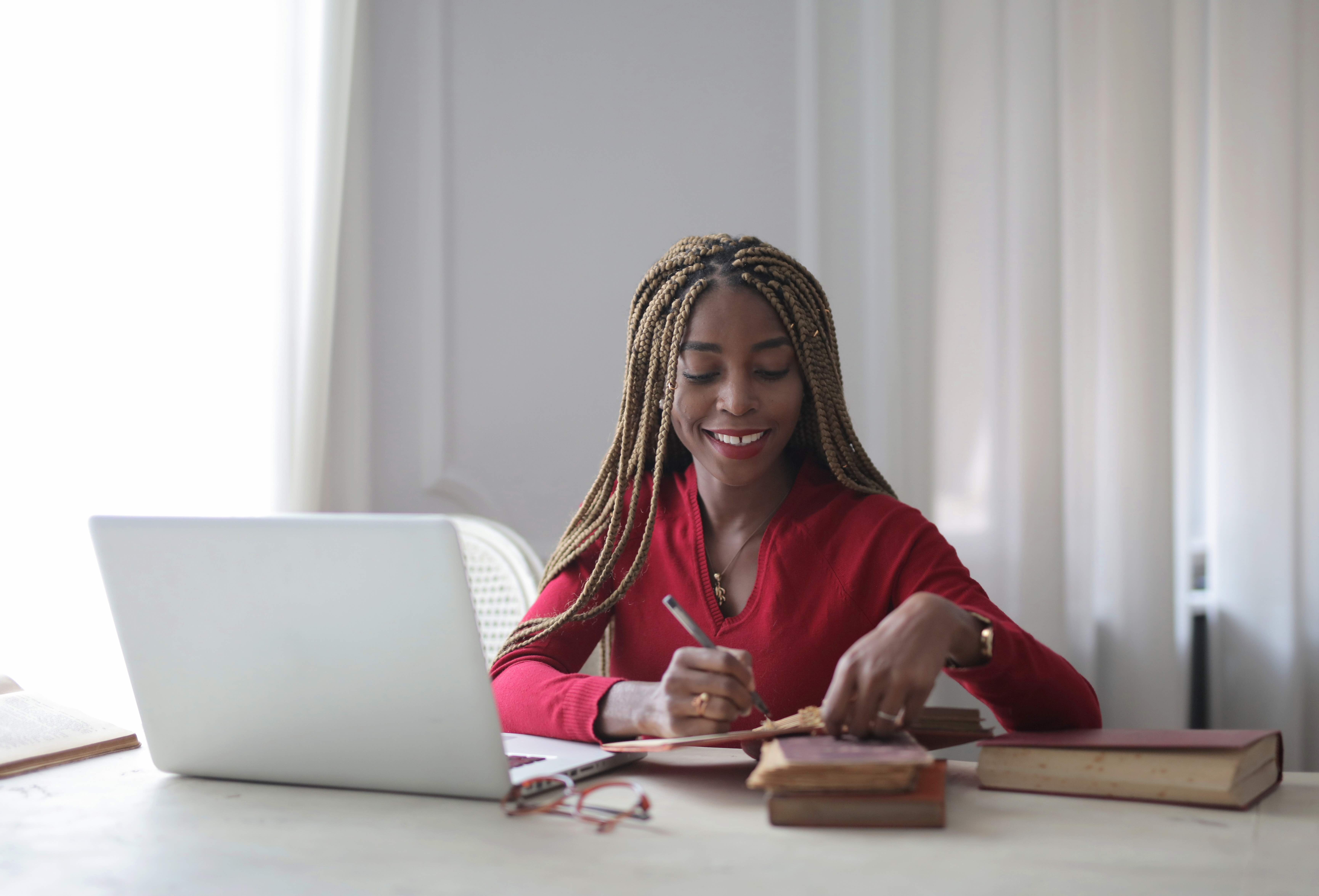 woman-sitting-in-front-of-laptop-3884406